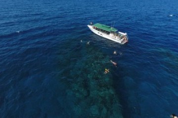 a small boat in a body of water